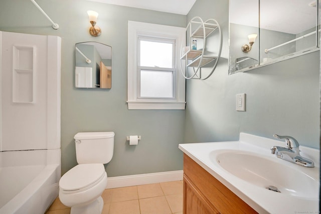 bathroom with toilet, vanity,  shower combination, baseboards, and tile patterned floors