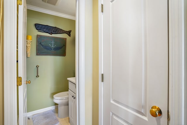 bathroom featuring visible vents, toilet, ornamental molding, vanity, and baseboards