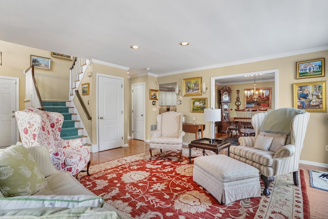 living room featuring recessed lighting, ornamental molding, a chandelier, baseboards, and stairs