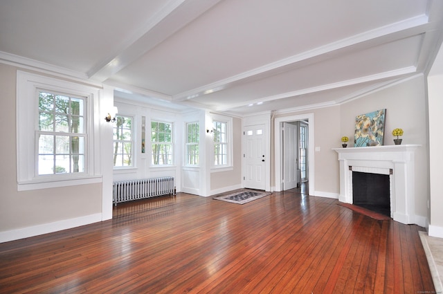 unfurnished living room with radiator, wood-type flooring, beam ceiling, and a fireplace with flush hearth