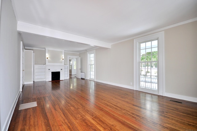 unfurnished living room with hardwood / wood-style flooring, a fireplace with flush hearth, and visible vents