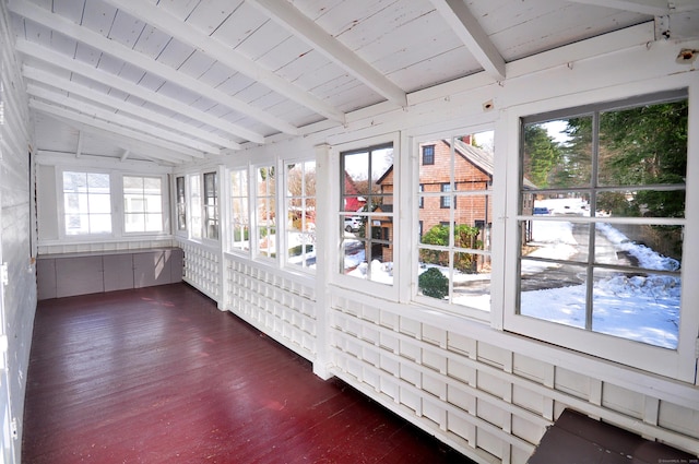 unfurnished sunroom featuring vaulted ceiling with beams and wooden ceiling