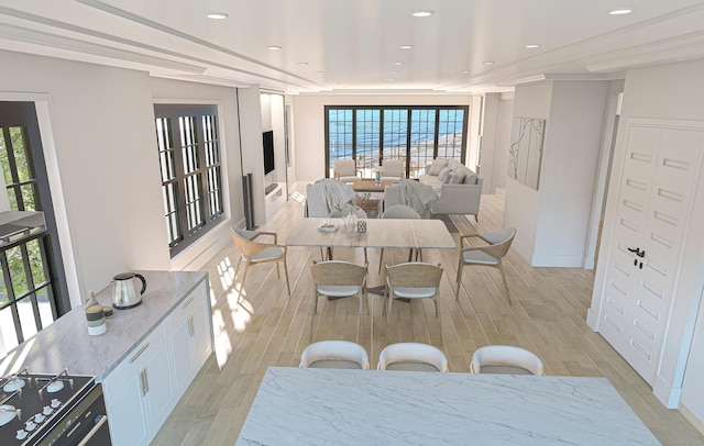 dining area featuring recessed lighting, plenty of natural light, and wood tiled floor