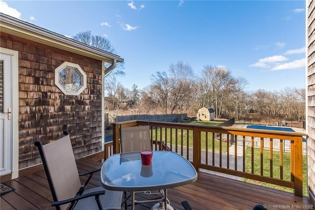 wooden deck with outdoor dining space