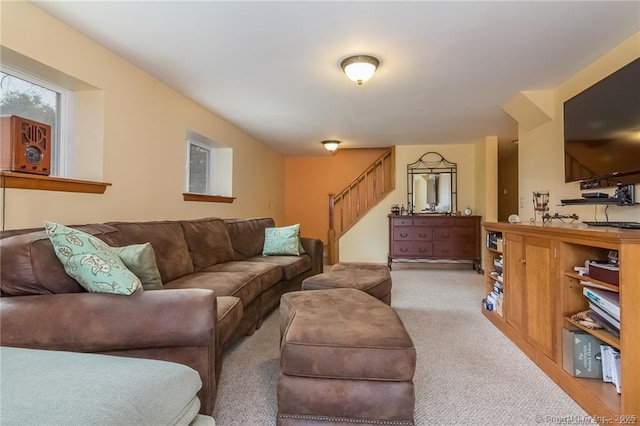 living room with carpet and stairway