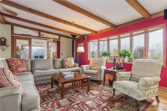 sunroom / solarium with lofted ceiling with beams