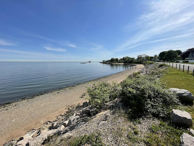 property view of water featuring fence