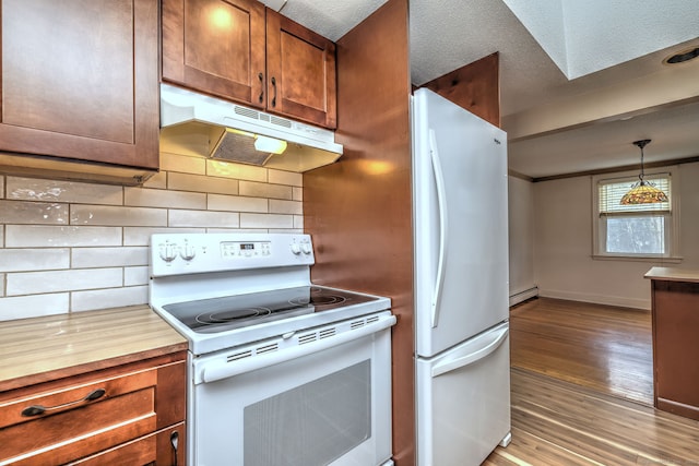 kitchen featuring white appliances, tasteful backsplash, a baseboard radiator, light wood-style flooring, and under cabinet range hood