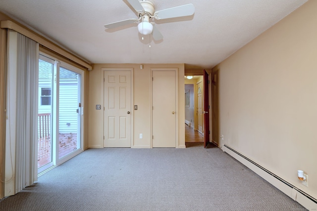 unfurnished bedroom with access to exterior, carpet flooring, baseboard heating, and a ceiling fan