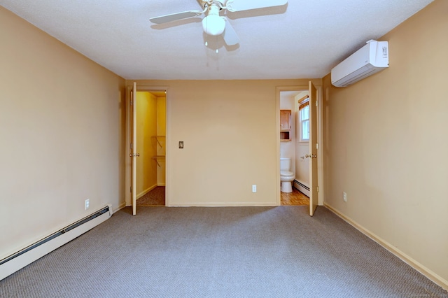 unfurnished bedroom featuring a baseboard radiator, a baseboard heating unit, carpet floors, baseboards, and a wall mounted air conditioner