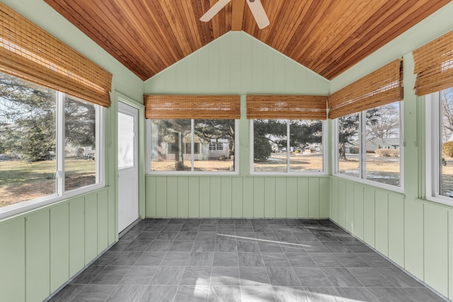 unfurnished sunroom with wooden ceiling, ceiling fan, and vaulted ceiling