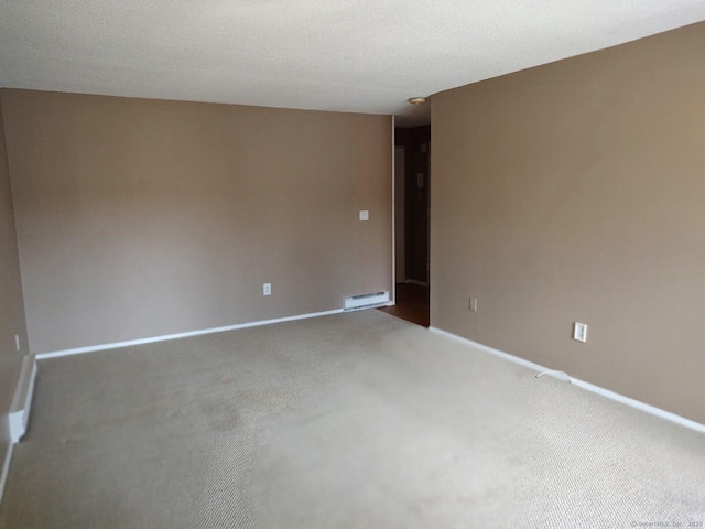 spare room featuring visible vents, baseboards, and a textured ceiling