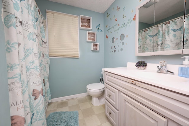 bathroom with a textured ceiling, toilet, vanity, baseboards, and tile patterned floors