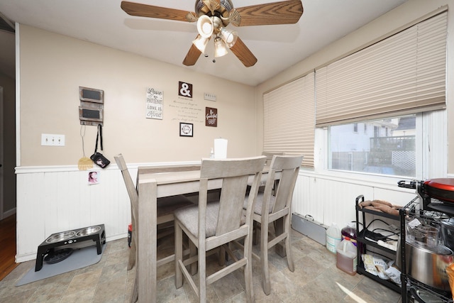 dining room featuring wainscoting