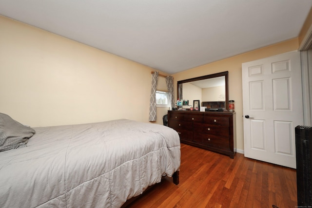 bedroom with wood finished floors