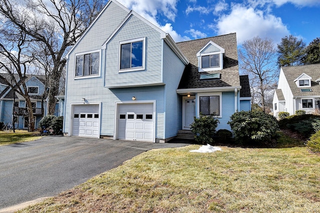 view of front of property with a garage, aphalt driveway, a front yard, and a shingled roof