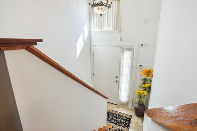 entryway with stairway and a healthy amount of sunlight