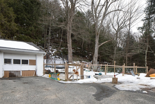 exterior space with a garage and an outdoor structure