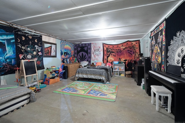 bedroom featuring unfinished concrete flooring