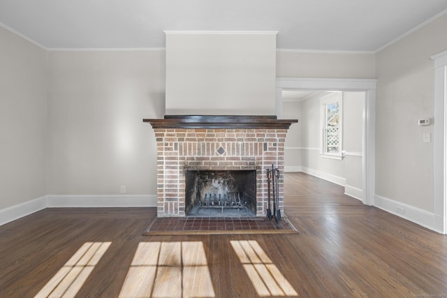 unfurnished living room featuring baseboards, dark wood finished floors, and crown molding