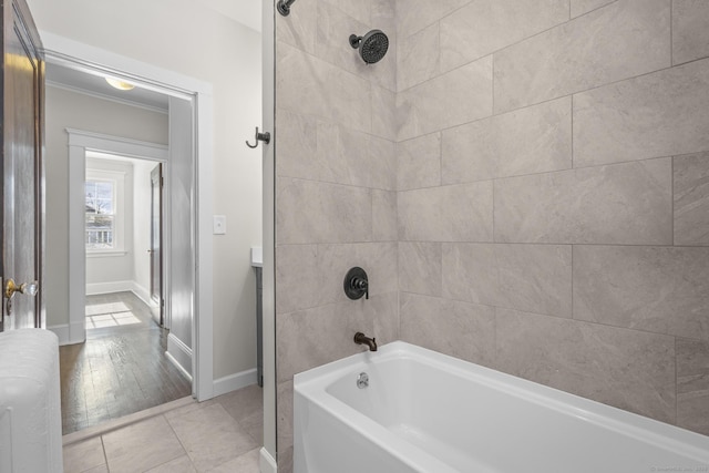 full bath featuring tile patterned floors, baseboards, and shower / bathing tub combination