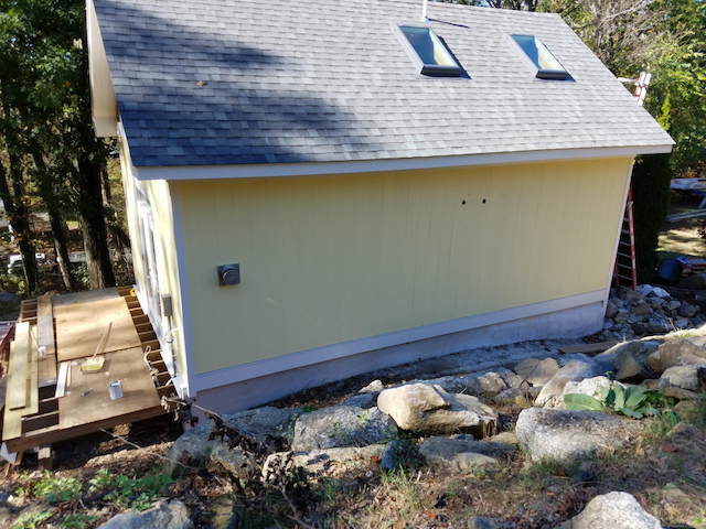 view of property exterior featuring roof with shingles