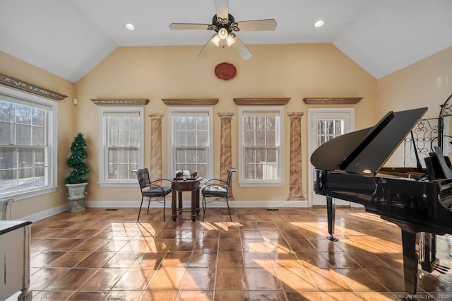 sitting room with lofted ceiling, ceiling fan, baseboards, and tile patterned flooring