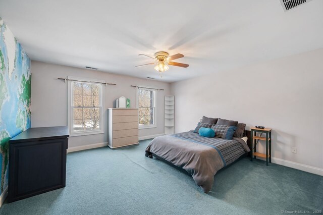 bedroom featuring a ceiling fan, carpet flooring, visible vents, and baseboards