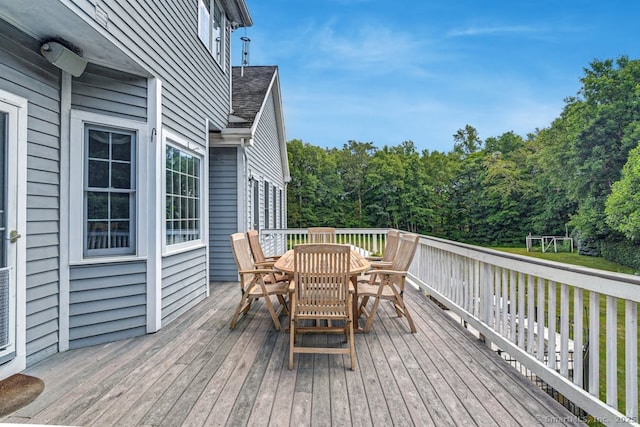 deck featuring outdoor dining area