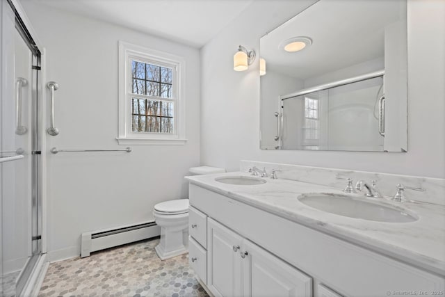 full bath featuring baseboard heating, a sink, and a shower stall