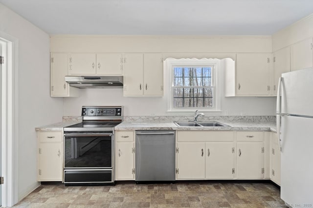 kitchen with under cabinet range hood, appliances with stainless steel finishes, light countertops, and a sink