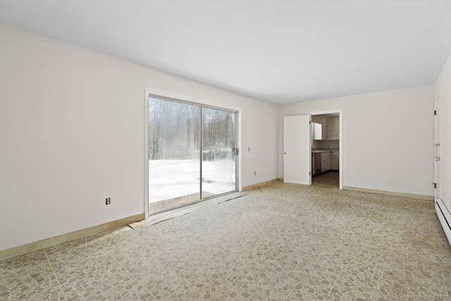 empty room featuring baseboards