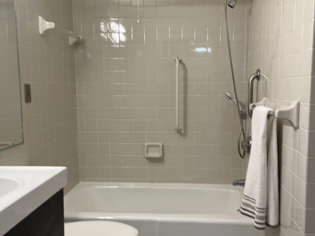 full bathroom with toilet, tub / shower combination, and vanity