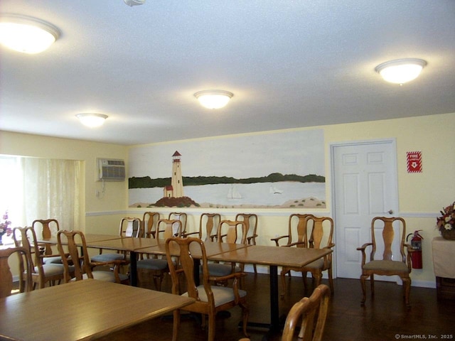 dining room with an AC wall unit