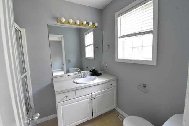 full bathroom with toilet, visible vents, baseboards, and vanity