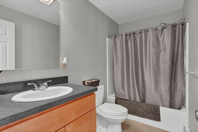 bathroom featuring shower / tub combo, vanity, toilet, and tile patterned floors