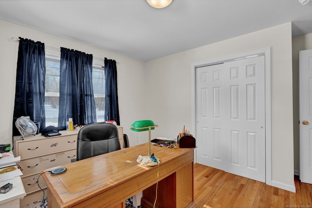 office area with light wood-style floors