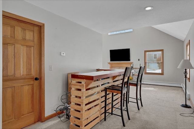 dining room featuring recessed lighting, light carpet, baseboards, vaulted ceiling, and baseboard heating