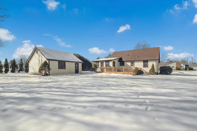 view of front of property with an outbuilding and a wooden deck