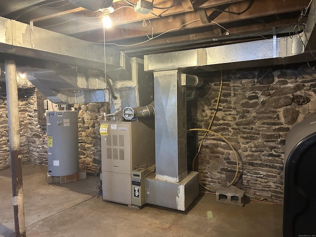 utility room with heating unit, water heater, and heating fuel