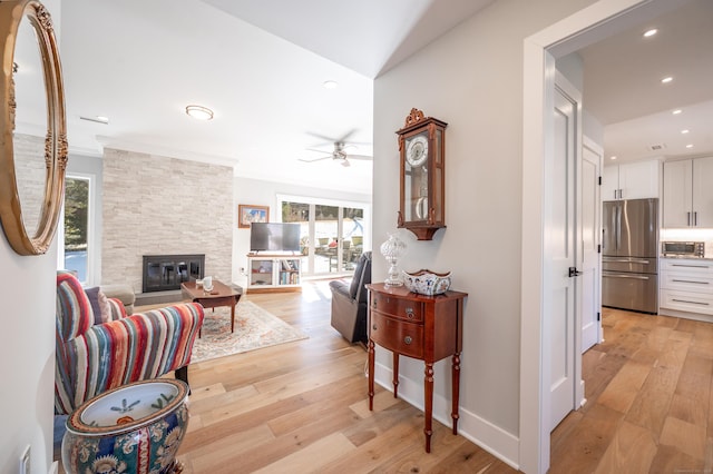 corridor with recessed lighting, baseboards, crown molding, and light wood finished floors