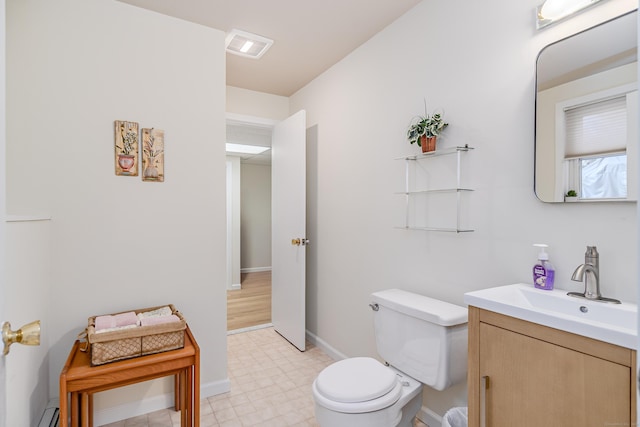 bathroom with visible vents, baseboards, toilet, a baseboard radiator, and vanity