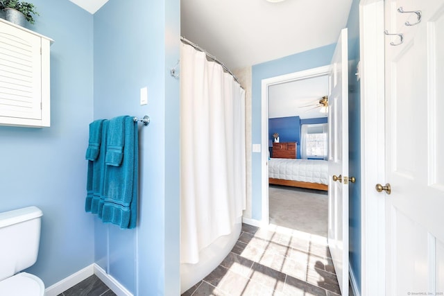 full bathroom with curtained shower, ensuite bath, toilet, and baseboards