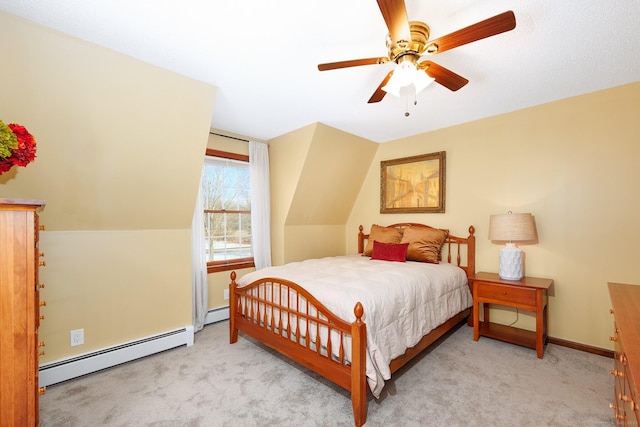 bedroom featuring lofted ceiling, ceiling fan, a baseboard radiator, carpet floors, and baseboards