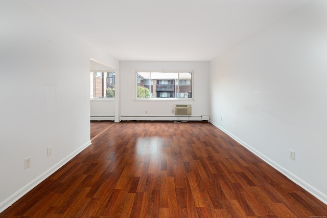 empty room with dark wood-type flooring and baseboards