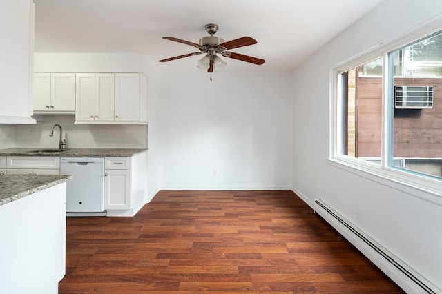 kitchen with a baseboard heating unit, white cabinets, dishwasher, and light stone countertops