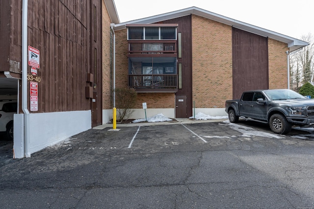 view of property featuring uncovered parking