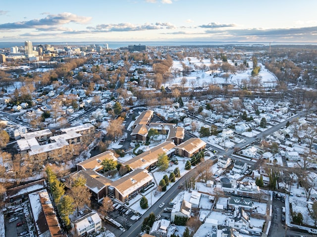 snowy aerial view with a residential view