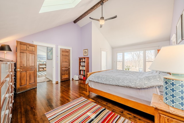 bedroom featuring ceiling fan, high vaulted ceiling, dark wood-style flooring, a skylight, and beamed ceiling