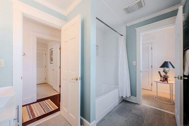 full bathroom with baseboards, ornamental molding, visible vents, and shower / tub combo